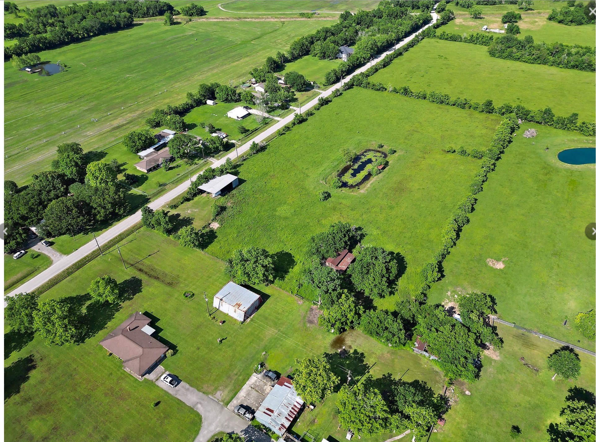 0 New Road Crosby, TX 77532 - Photo 3 of 5 a view of a large body of water with a yard