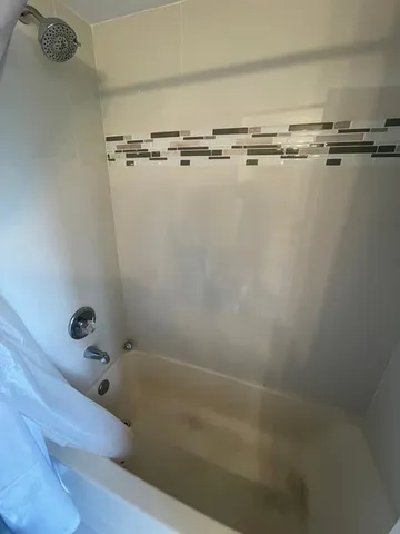 a close view of a bathtub in bathroom
