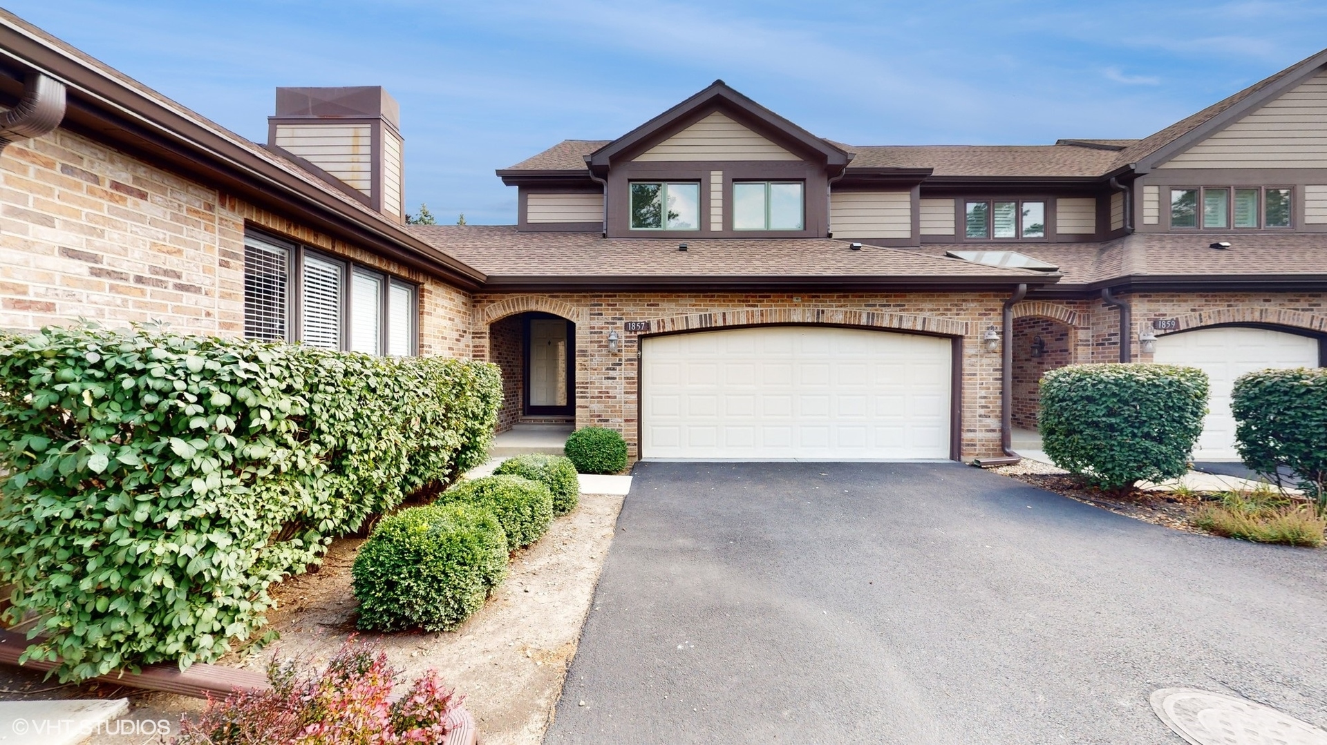 1857 Golfview Drive Bartlett, IL 60103 - Photo 1 of 26 a front view of a house with a yard and garage