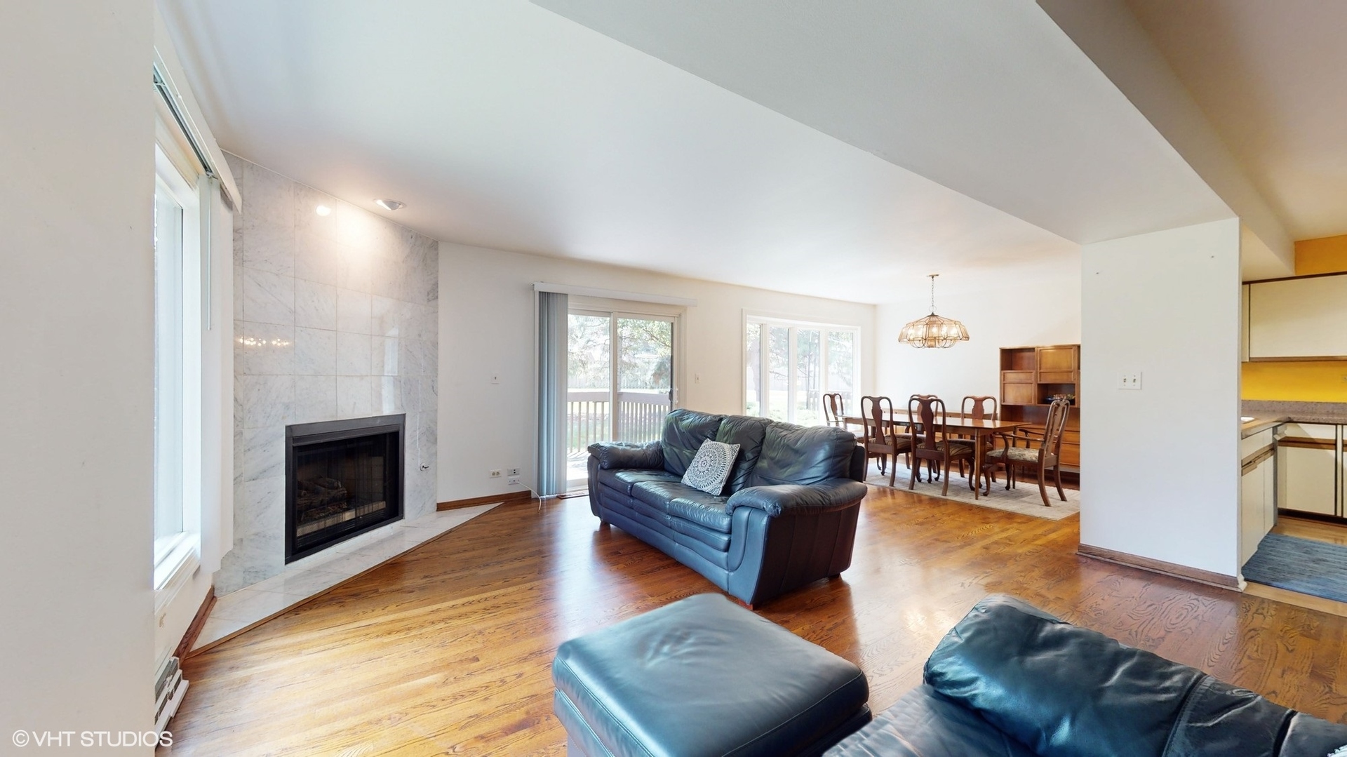 1857 Golfview Drive Bartlett, IL 60103 - Photo 15 of 26 a living room with furniture a fireplace and a flat screen tv