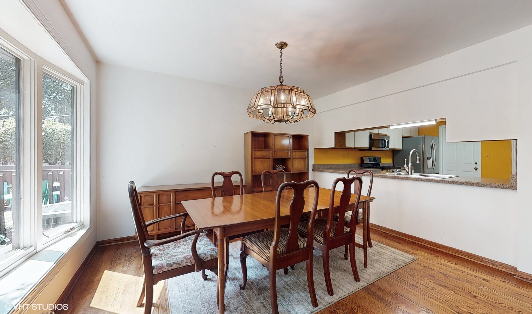 1857 Golfview Drive Bartlett, IL 60103 - Photo 16 of 26 a view of a dining room with furniture window and wooden floor