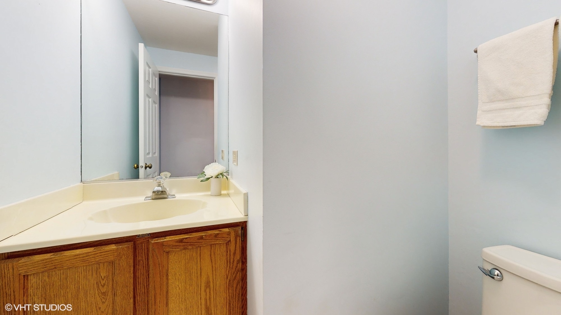 1857 Golfview Drive Bartlett, IL 60103 - Photo 18 of 26 a bathroom with a sink and a mirror
