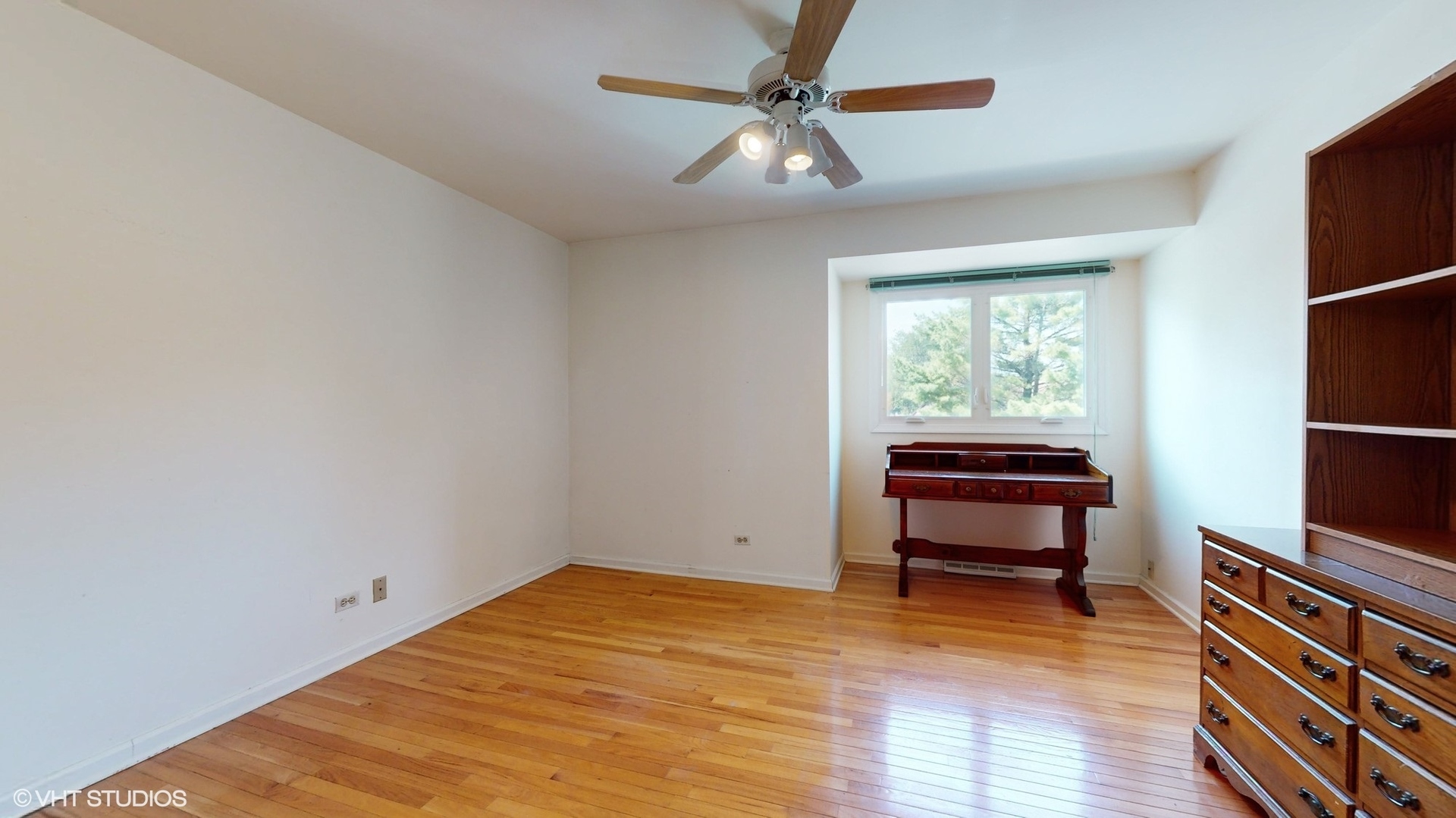 1857 Golfview Drive Bartlett, IL 60103 - Photo 9 of 26 a view of a room with wooden floor ceiling fan and windows