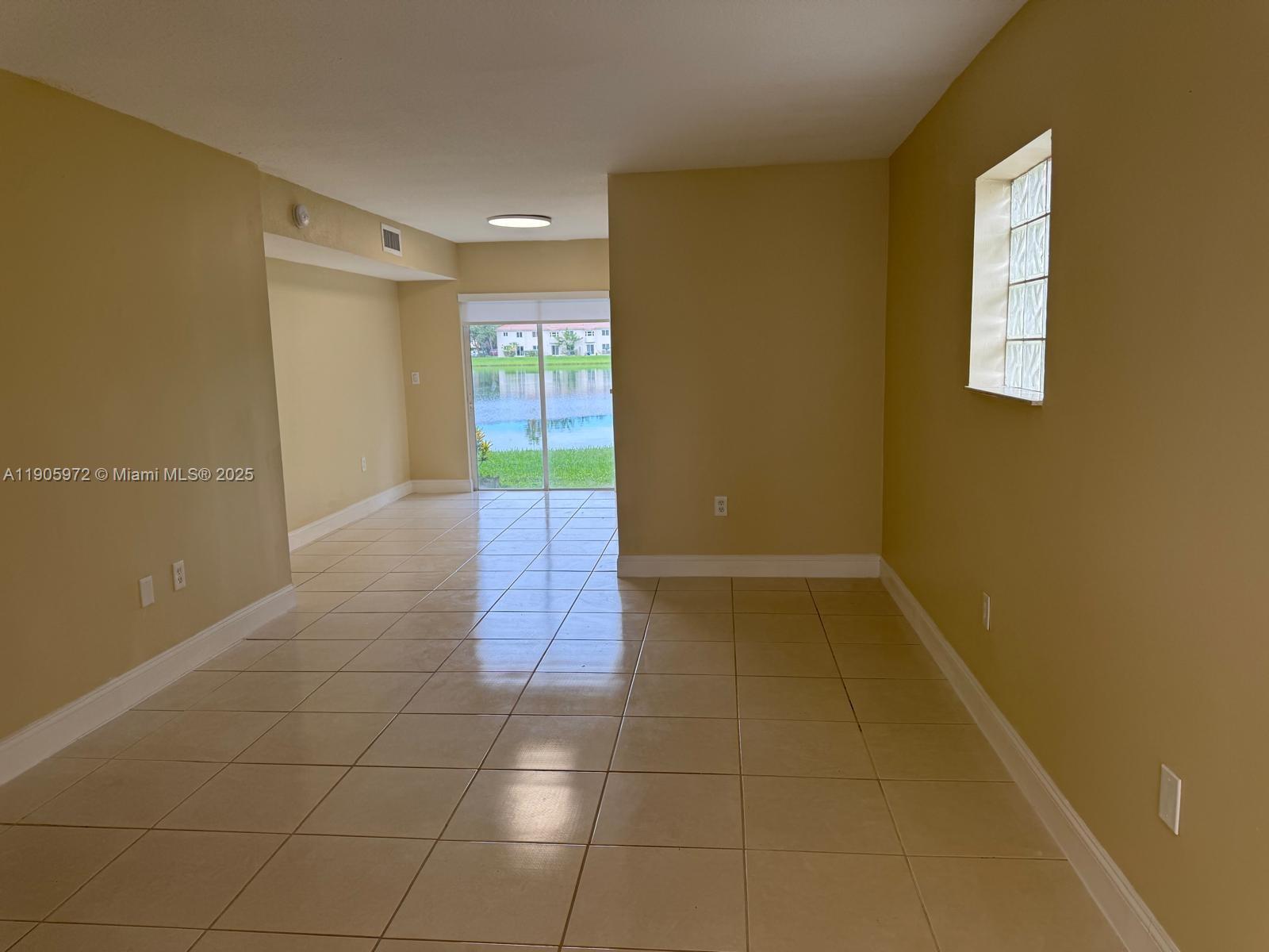 1261 Southeast 31st Court, Unit 10653 Homestead, FL 33035 - Photo 2 of 10 a view of hallway with window