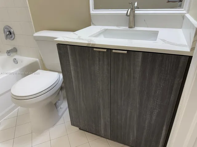 a bathroom with a toilet and a sink