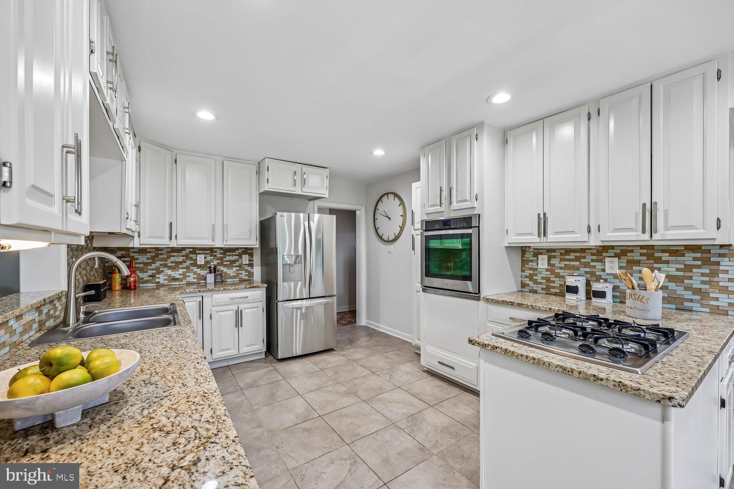 300 Gilsan Court Silver Spring, MD 20902 - Photo 45 of 117 a kitchen with a stove a refrigerator and a sink