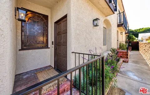 a view of balcony with furniture