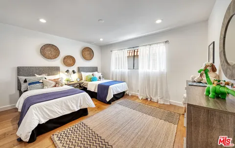 a bedroom with bed and a window