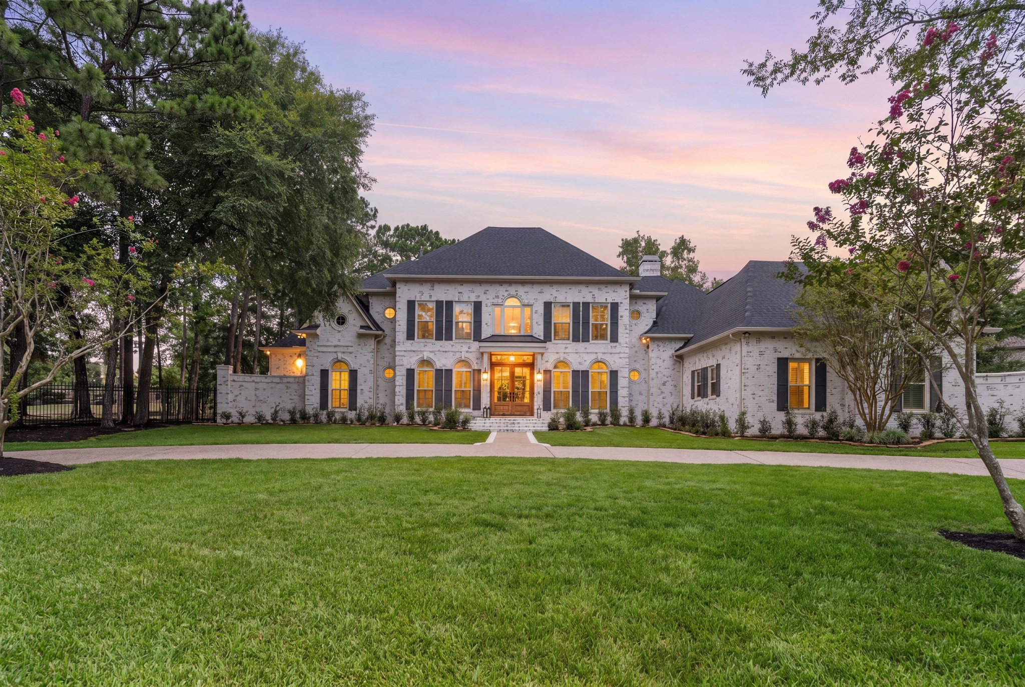 31 Hollymead Drive Spring, TX 77381 - Photo 1 of 50 Welcome to 31 Hollymead located in the heart of the Woodlands, in one of the most desirable sections, Hollymead. Located at the end of a cul-de-sac street on almost an acre lot. It backs to the King Golf Course of the Woodland CC. This grand two-story home features classic brick with German smear exterior, surrounded by lush landscaping. The house features 6 bedrooms, 5.5 bathrooms and an oversized 4 car garage, Pool/Spa, outdoor kitchen and outdoor fireplace.