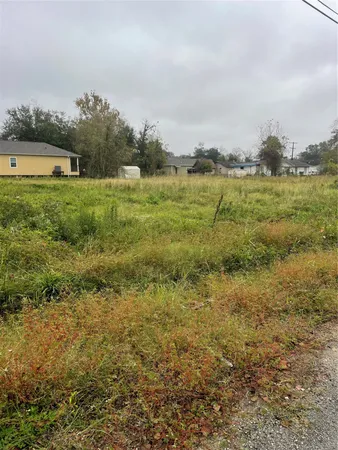 a view of a lake with houses in the back