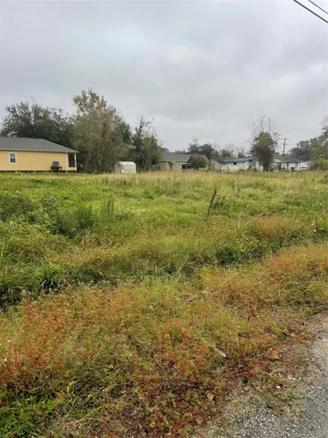 a view of a lake with houses in the back
