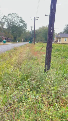 a view of a field with sitting area