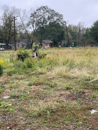 a view of a field with sitting area