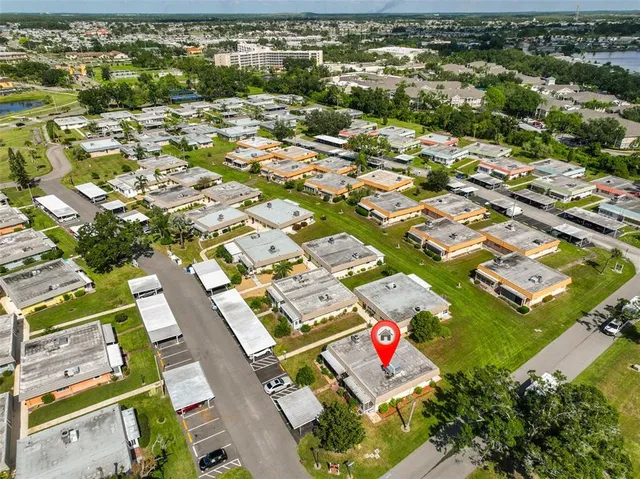 a living room with lots of furniture and kitchen view