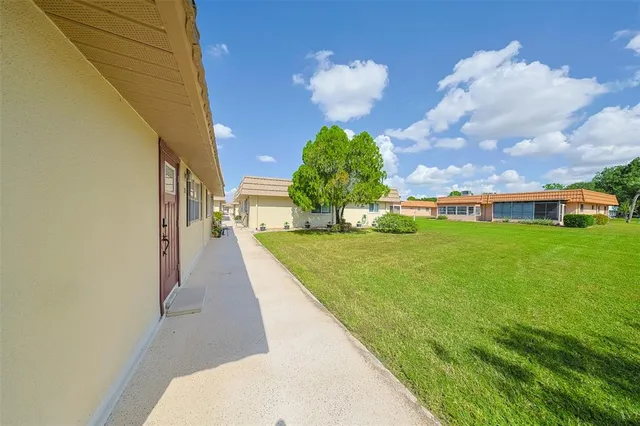 a view of a kitchen with a sink cabinets and appliances