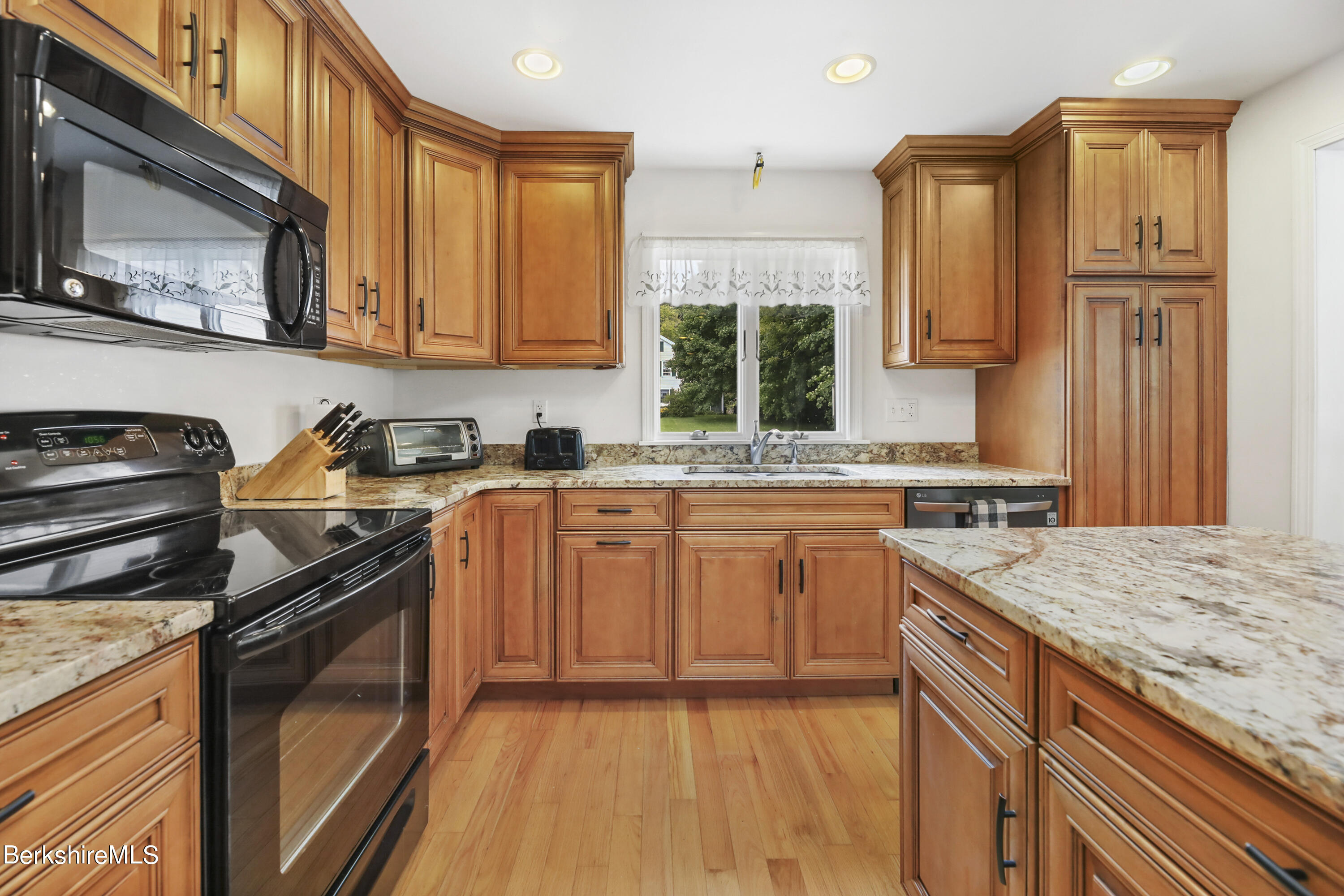 4 Swamp Road West Stockbridge, MA 01266 - Photo 12 of 35 a kitchen with stainless steel appliances granite countertop a stove a sink and a microwave