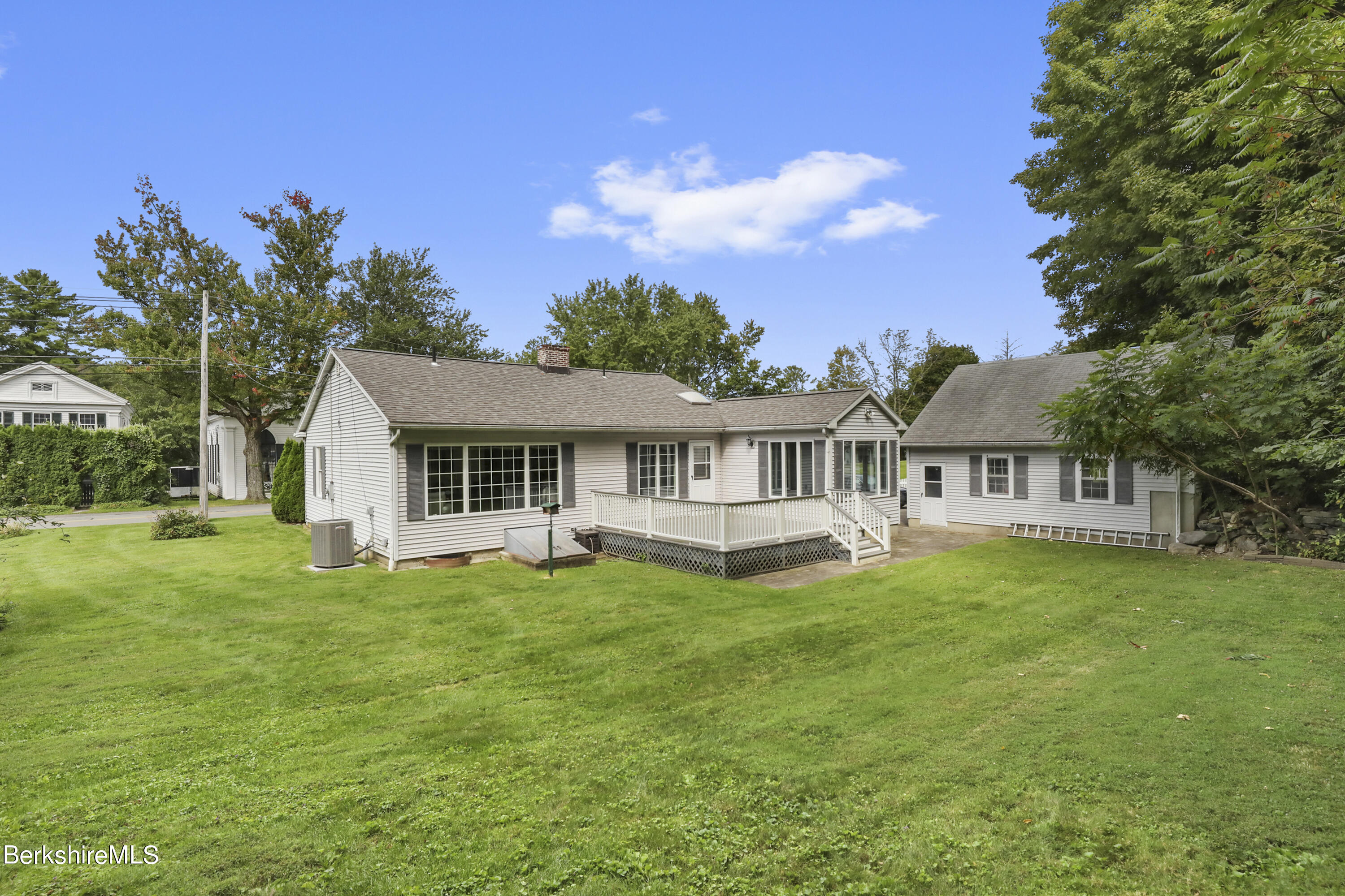 4 Swamp Road West Stockbridge, MA 01266 - Photo 27 of 35 a front view of a house with a garden and trees