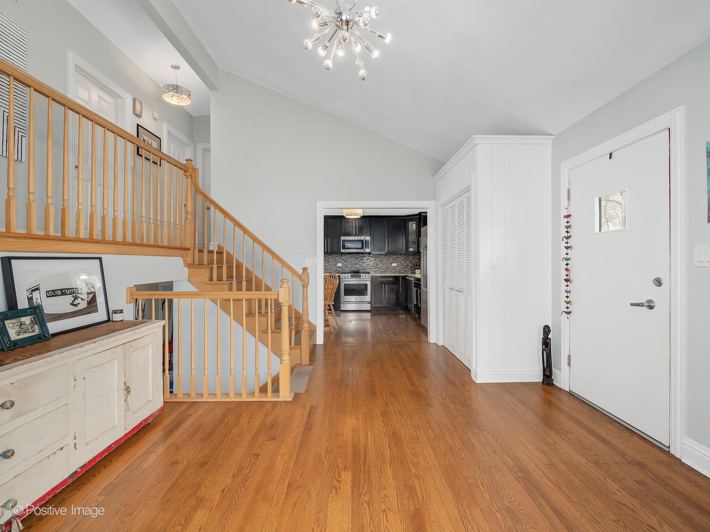 319 Maple Street Glen Ellyn, IL 60137 - Photo 6 of 26 a view of a kitchen with wooden floor and electronic appliances