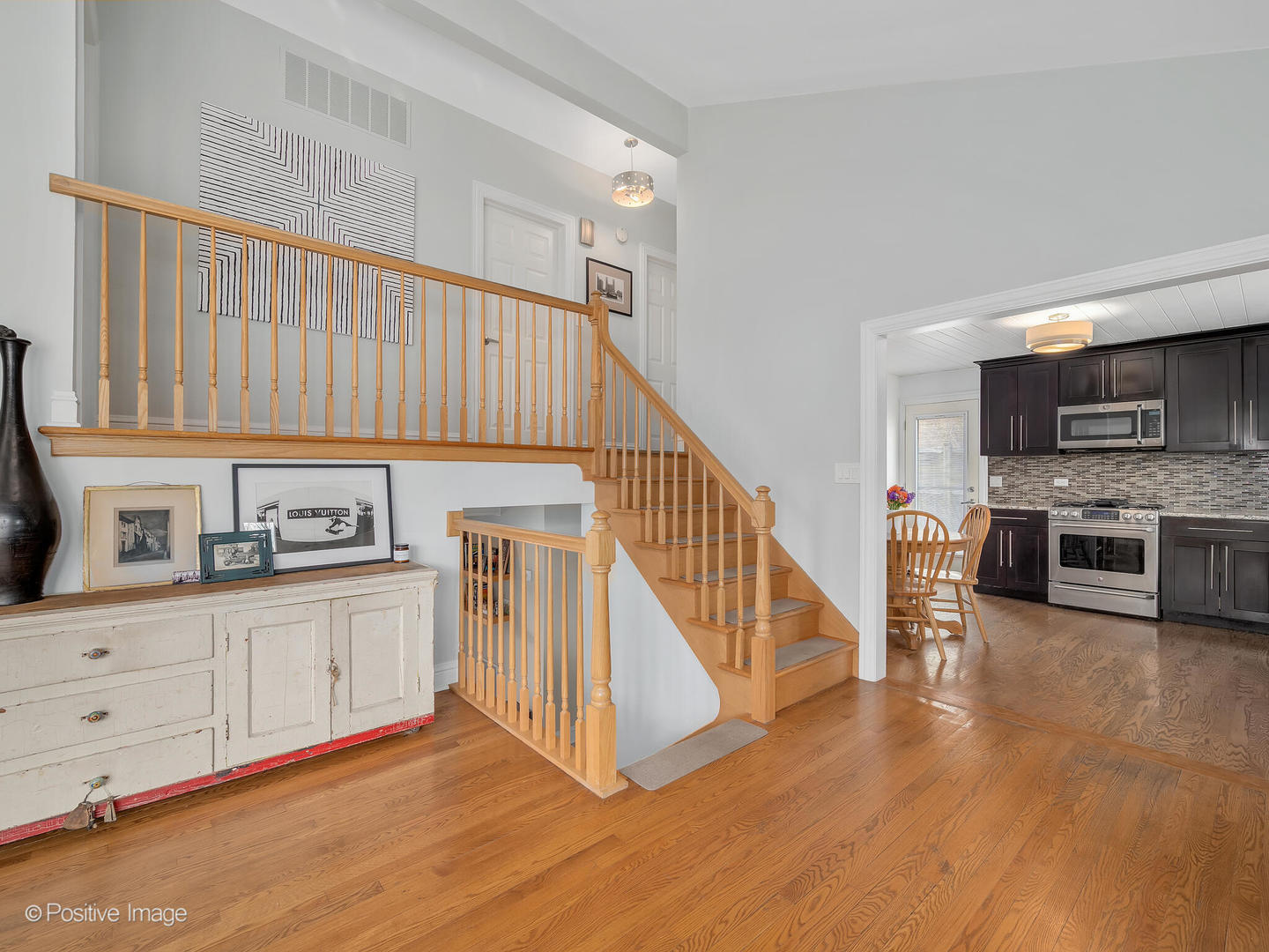 319 Maple Street Glen Ellyn, IL 60137 - Photo 7 of 26 a kitchen with granite countertop a stove top oven and cabinets