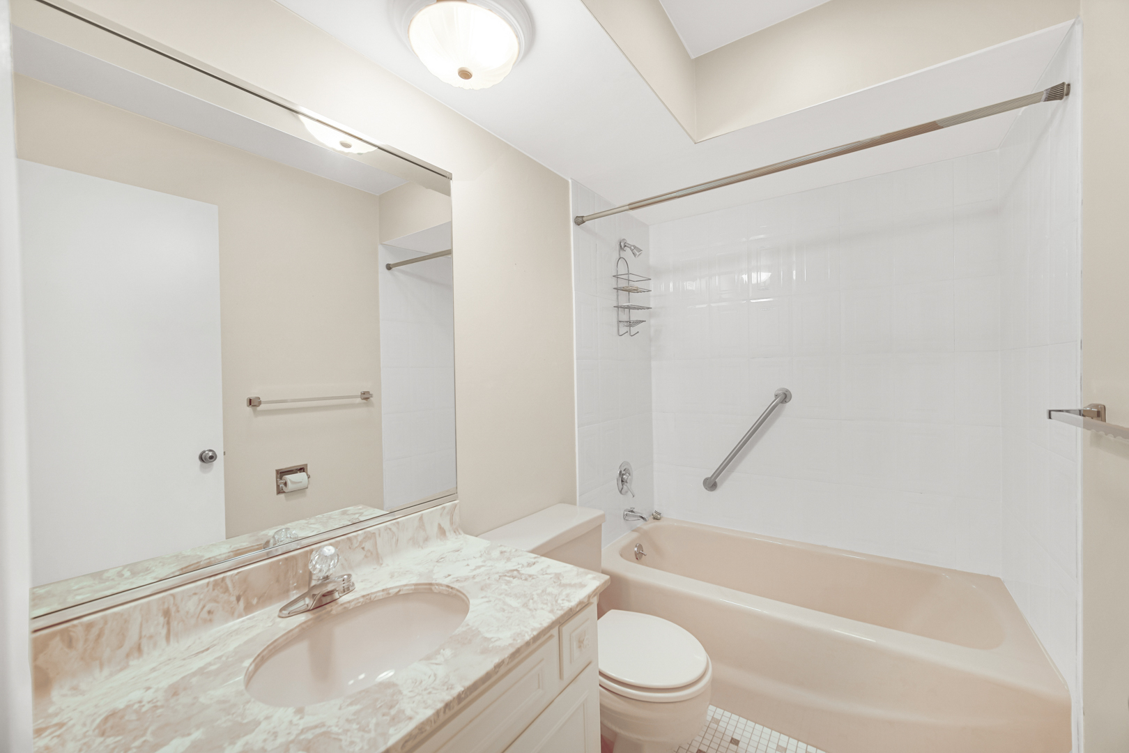 445 North Park Boulevard, Unit 3F Glen Ellyn, IL 60137 - Photo 16 of 20 a bathroom with a granite countertop bathtub shower sink vanity mirror and toilet