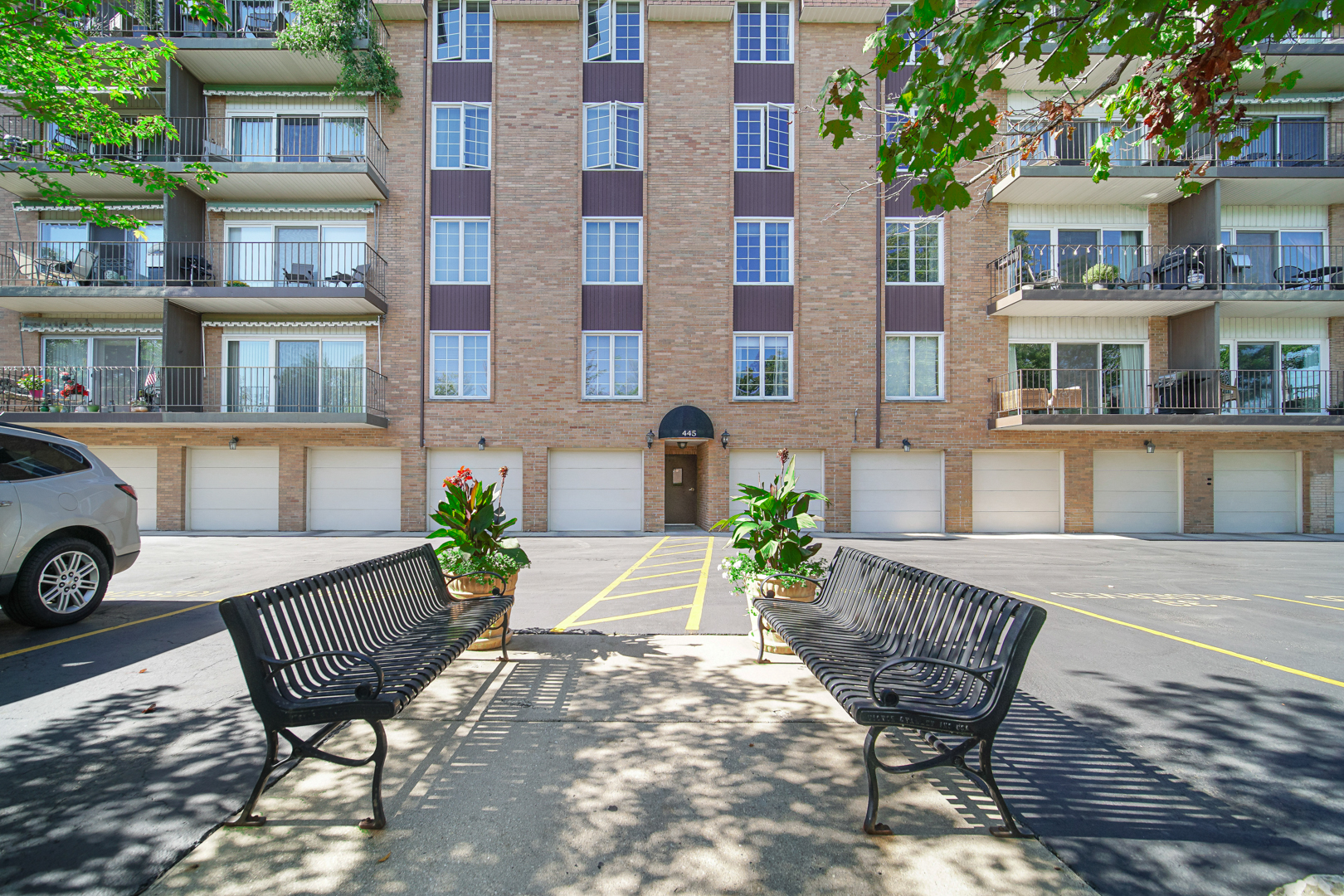 445 North Park Boulevard, Unit 3F Glen Ellyn, IL 60137 - Photo 20 of 20 a view of a chairs and table in the balcony