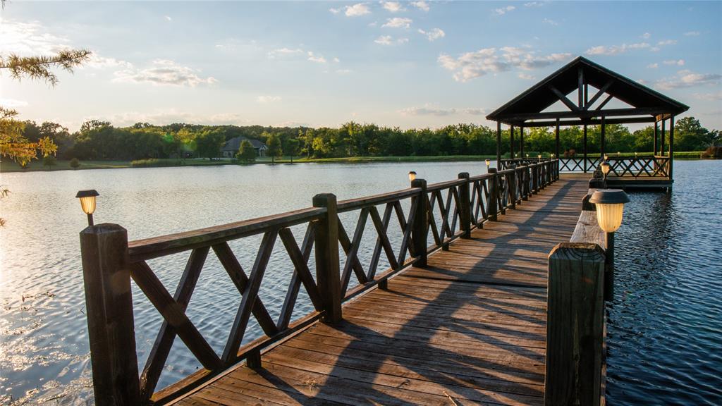 0 High Point Circle Sulphur Springs, TX 75482 - Photo 4 of 4 a view of a street with wooden stairs and a bench