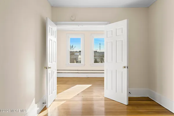 a view of walk in closet with empty racks