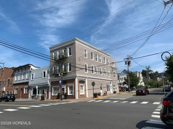 a front view of a building with a street
