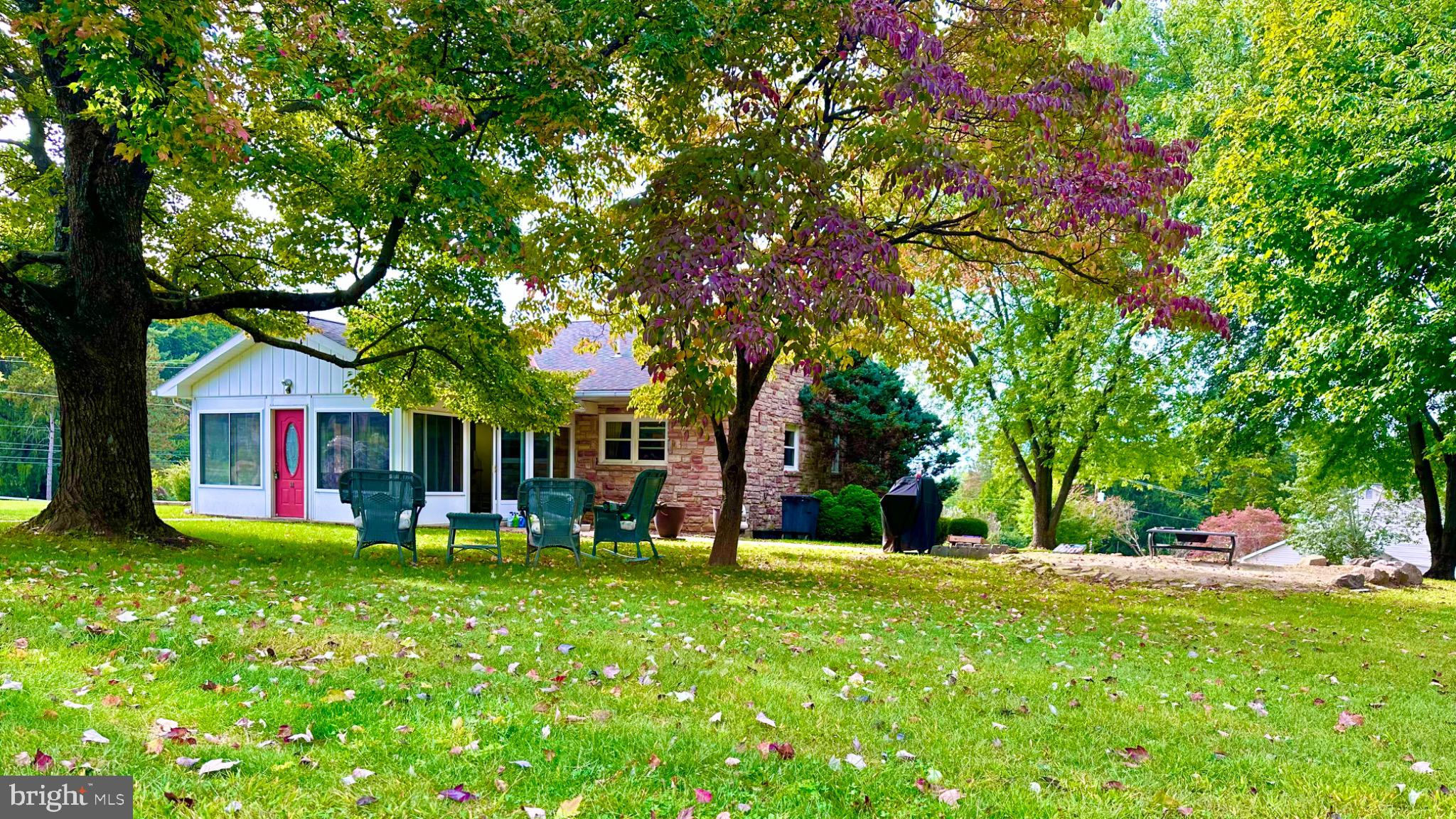 98 Maple Street Macungie, PA 18062 - Photo 1 of 56 a front view of a house with garden
