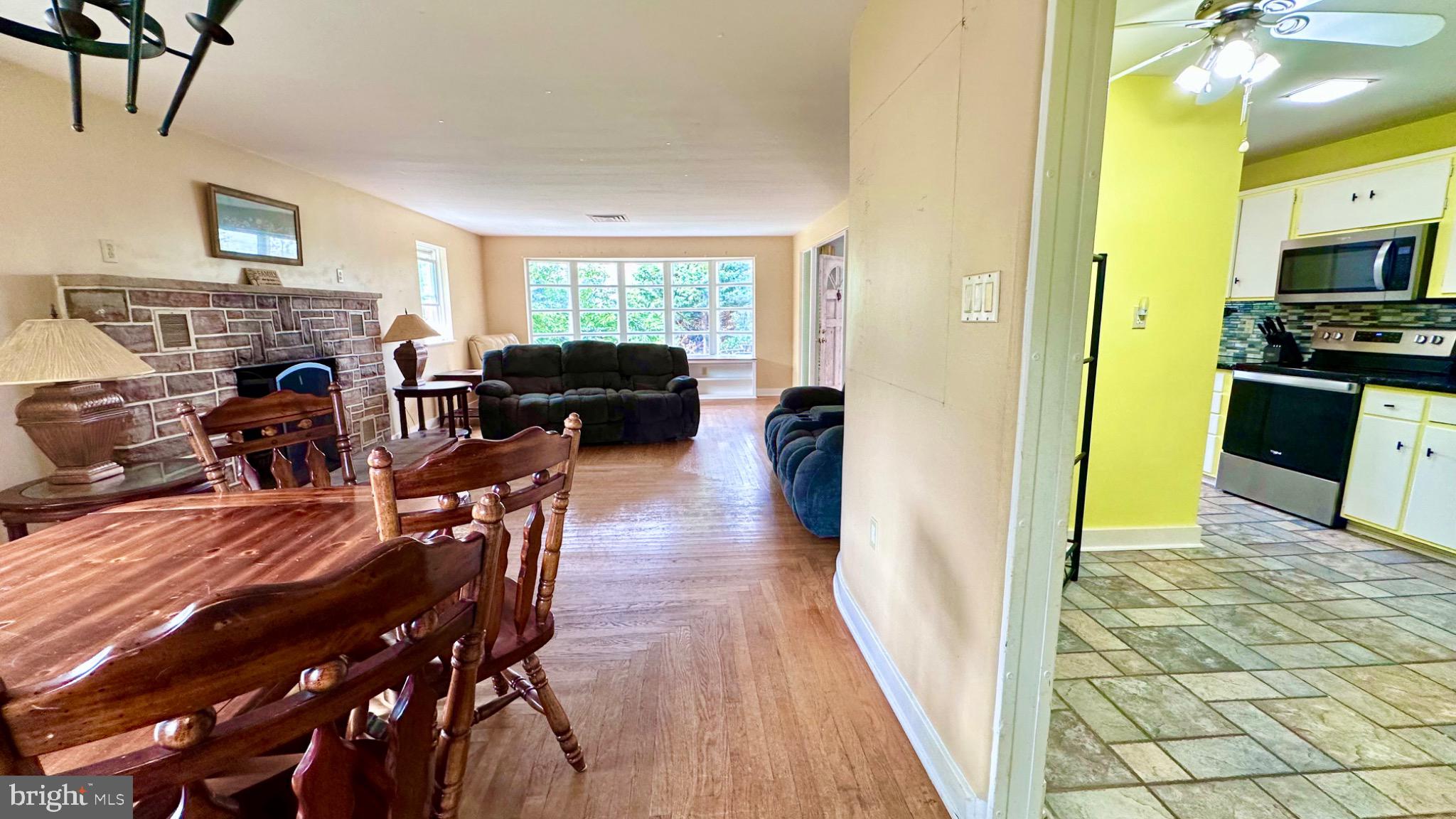 98 Maple Street Macungie, PA 18062 - Photo 12 of 56 a view of a dining room with furniture window and wooden floor