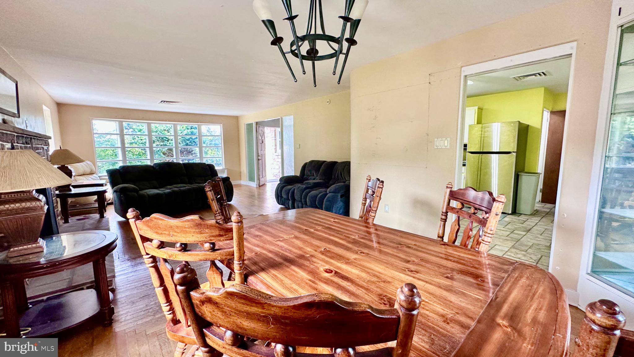 98 Maple Street Macungie, PA 18062 - Photo 13 of 56 a bedroom with a bed and a table with chair