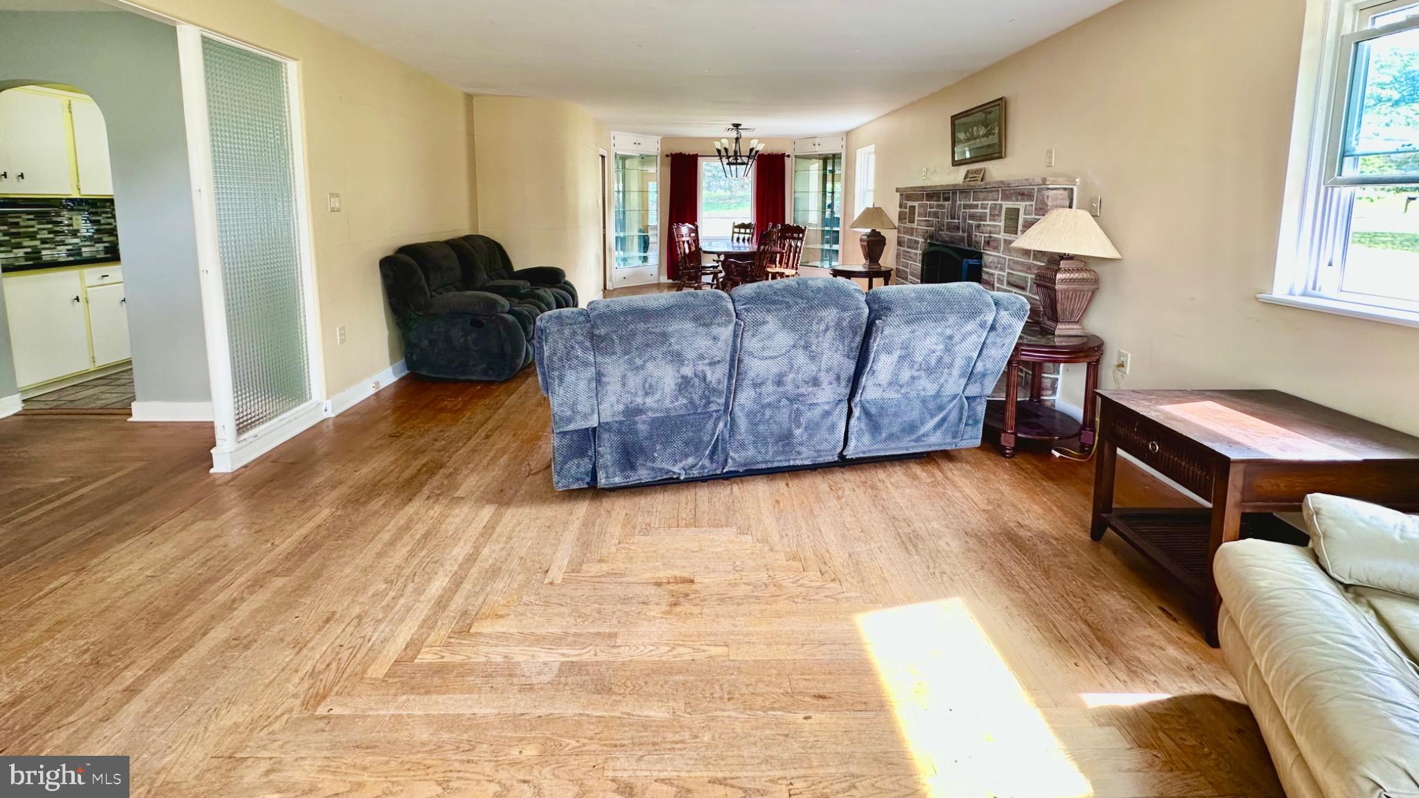 98 Maple Street Macungie, PA 18062 - Photo 15 of 56 a living room with furniture and a wooden floor