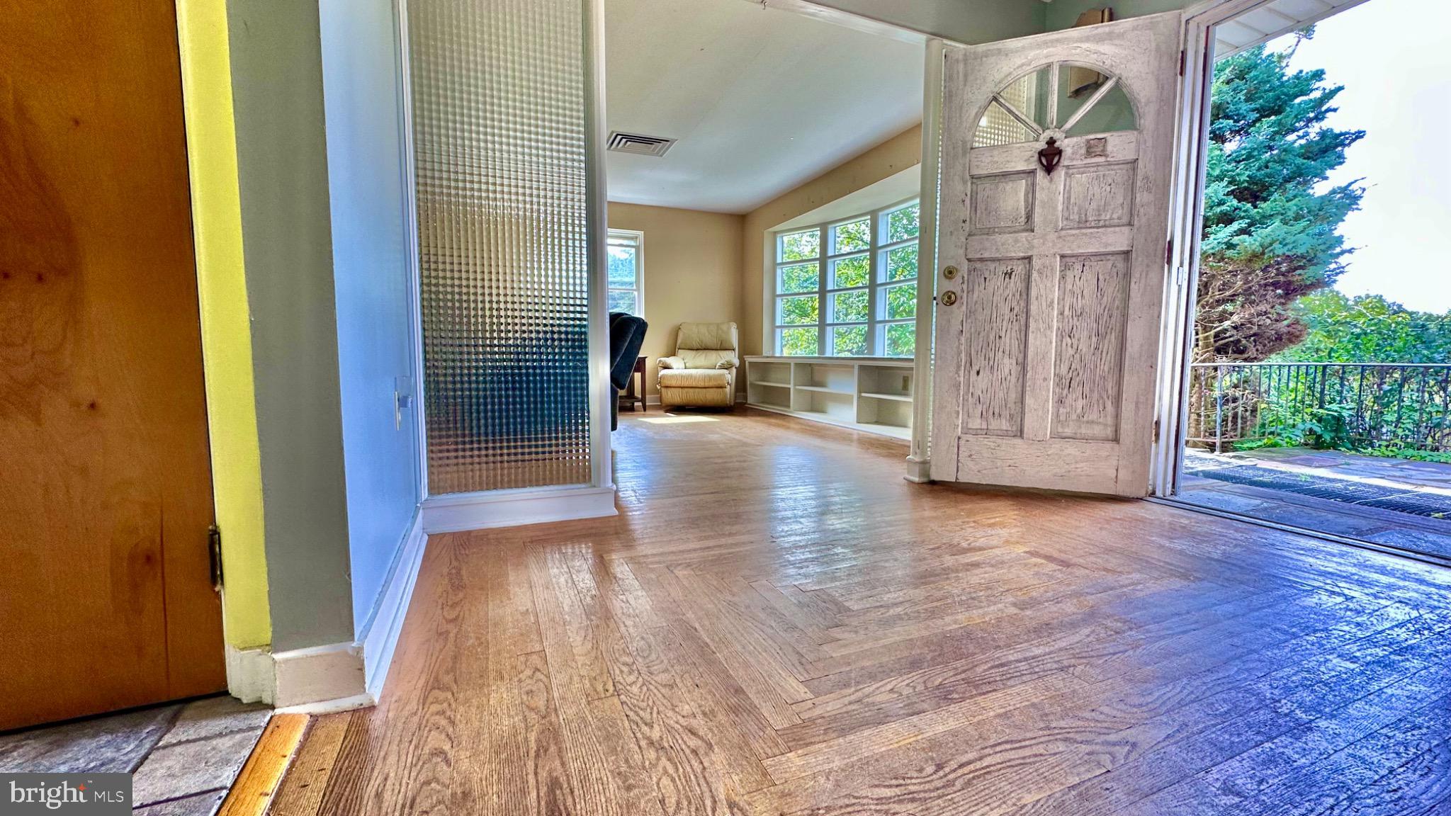 98 Maple Street Macungie, PA 18062 - Photo 18 of 56 a view of livingroom with hardwood floor and stairs