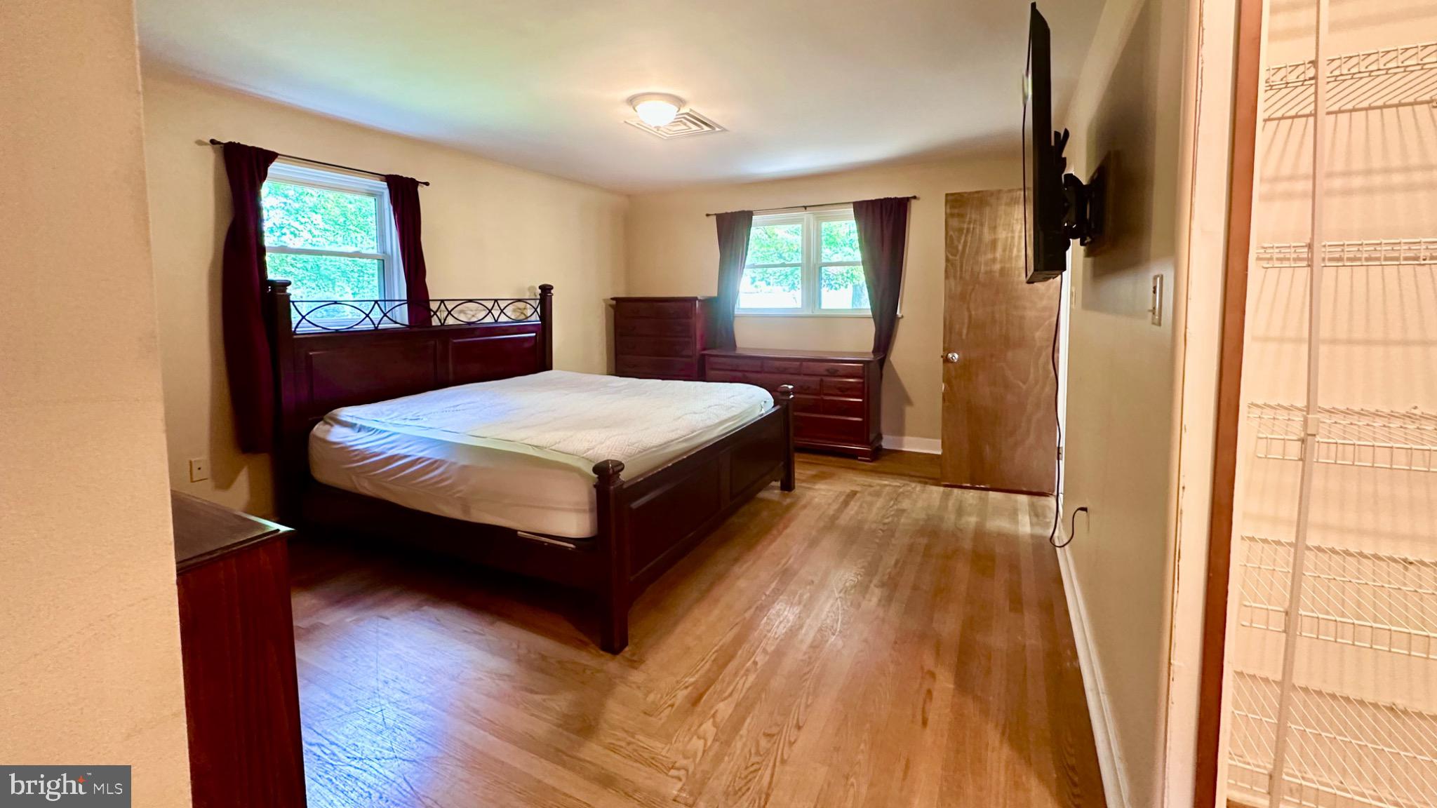 98 Maple Street Macungie, PA 18062 - Photo 19 of 56 a bedroom with a bed a window and dresser