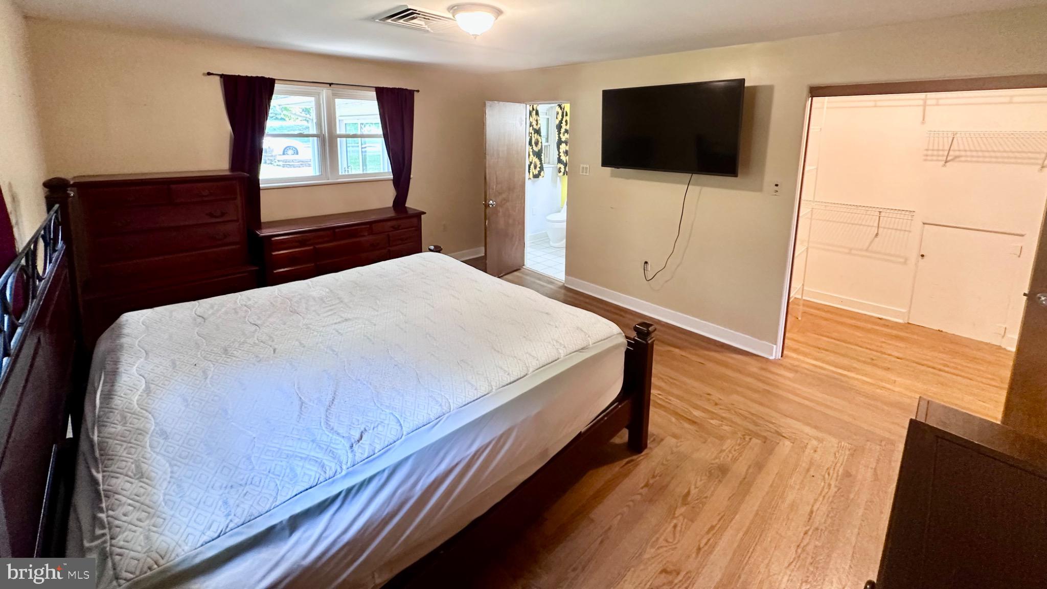 98 Maple Street Macungie, PA 18062 - Photo 20 of 56 a bedroom with a bed and a flat screen tv