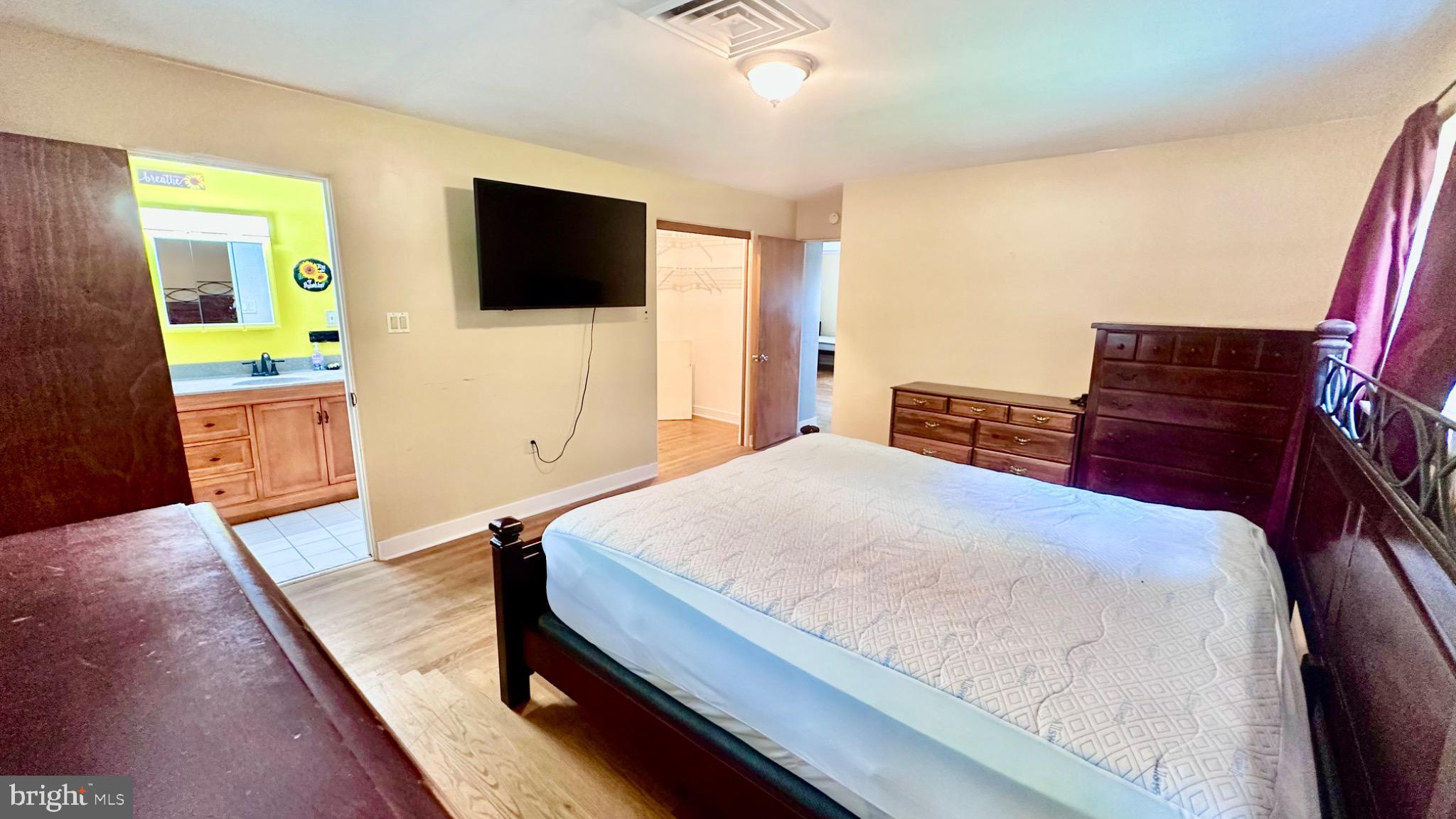 98 Maple Street Macungie, PA 18062 - Photo 23 of 56 a bedroom with a bed and a flat screen tv