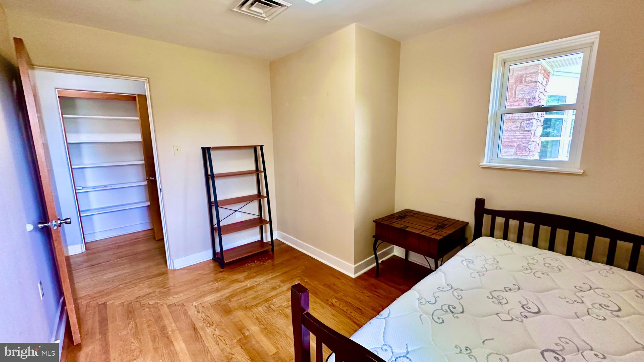98 Maple Street Macungie, PA 18062 - Photo 28 of 56 a bedroom with furniture and wooden floor
