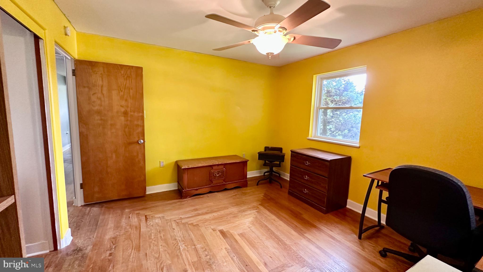 98 Maple Street Macungie, PA 18062 - Photo 29 of 56 a bedroom with a bed and wooden floor