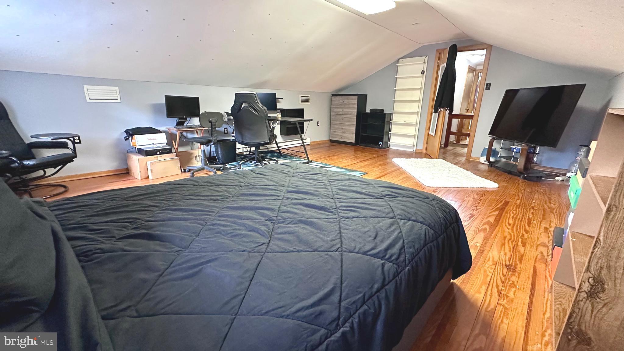 98 Maple Street Macungie, PA 18062 - Photo 36 of 56 a bed sitting in a bedroom and tv