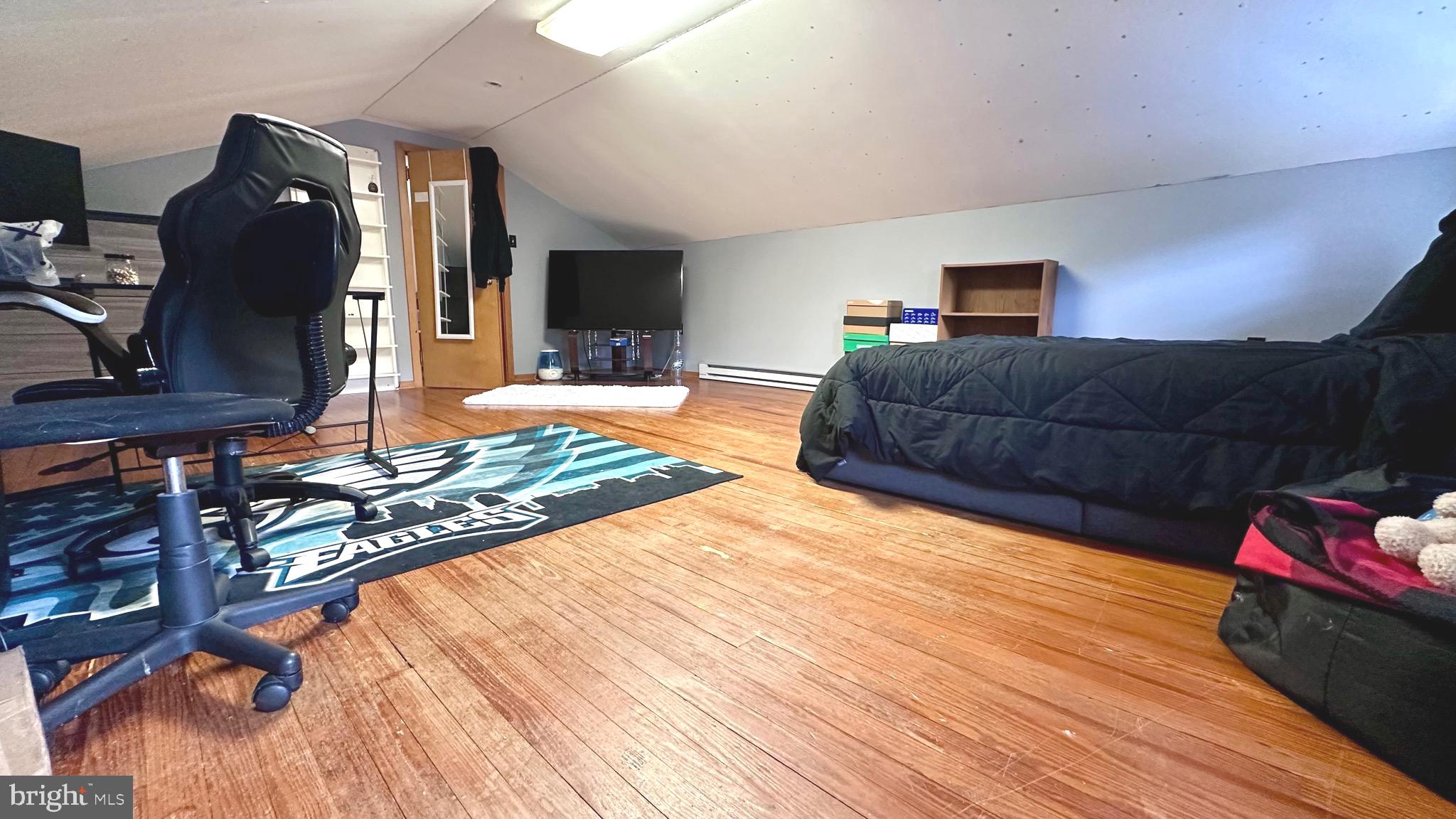 98 Maple Street Macungie, PA 18062 - Photo 37 of 56 a bedroom with a bed and a flat screen tv