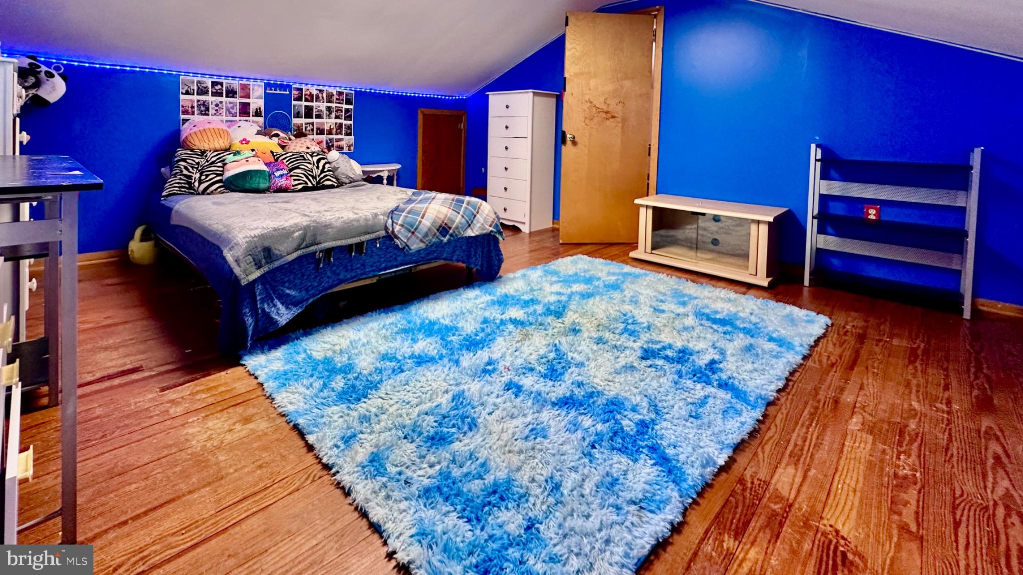 98 Maple Street Macungie, PA 18062 - Photo 40 of 56 a bedroom with bed and wooden floor
