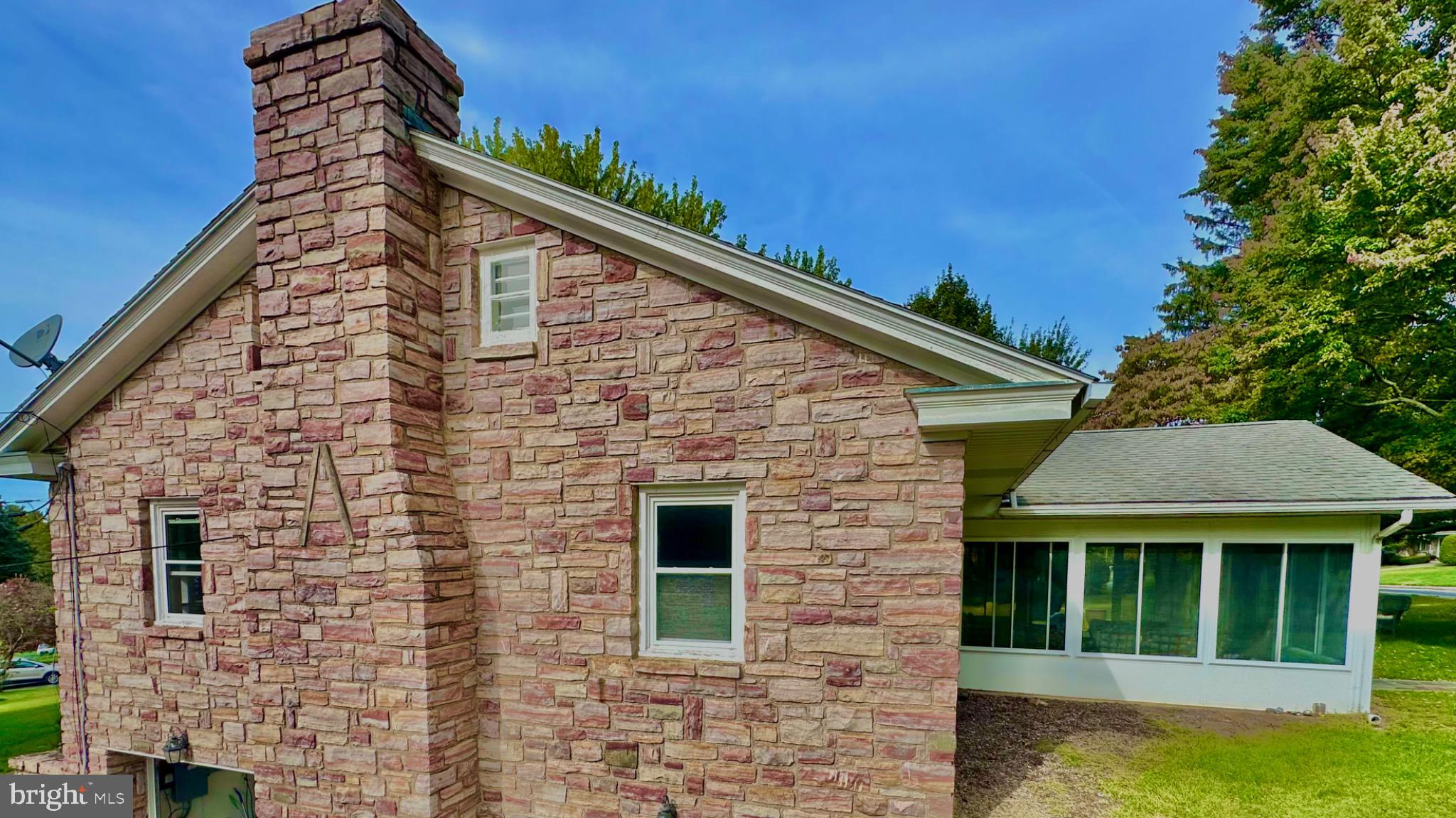 98 Maple Street Macungie, PA 18062 - Photo 51 of 56 a brick house with a large windows