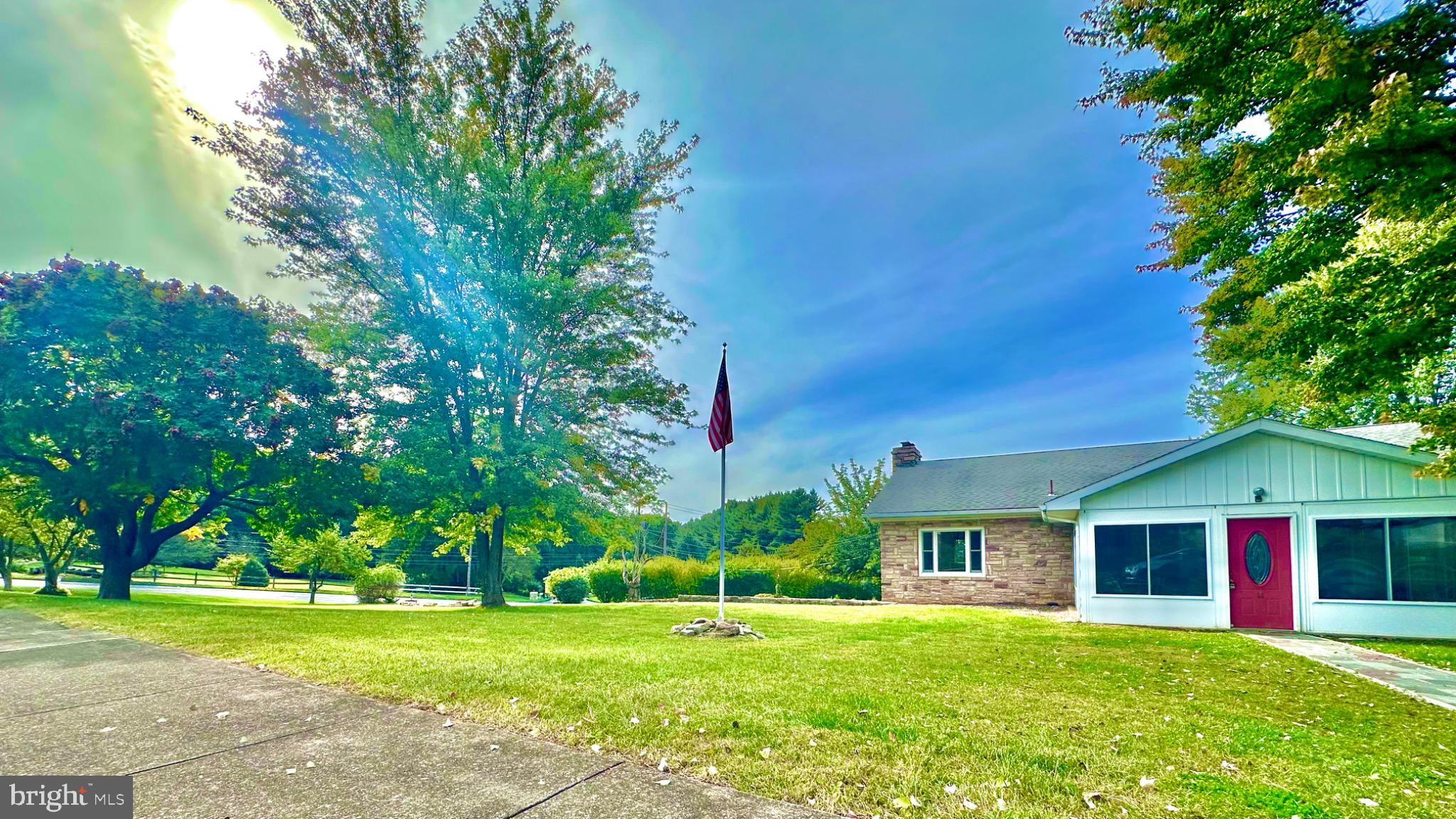 98 Maple Street Macungie, PA 18062 - Photo 56 of 56 a front view of a house with a yard and trees