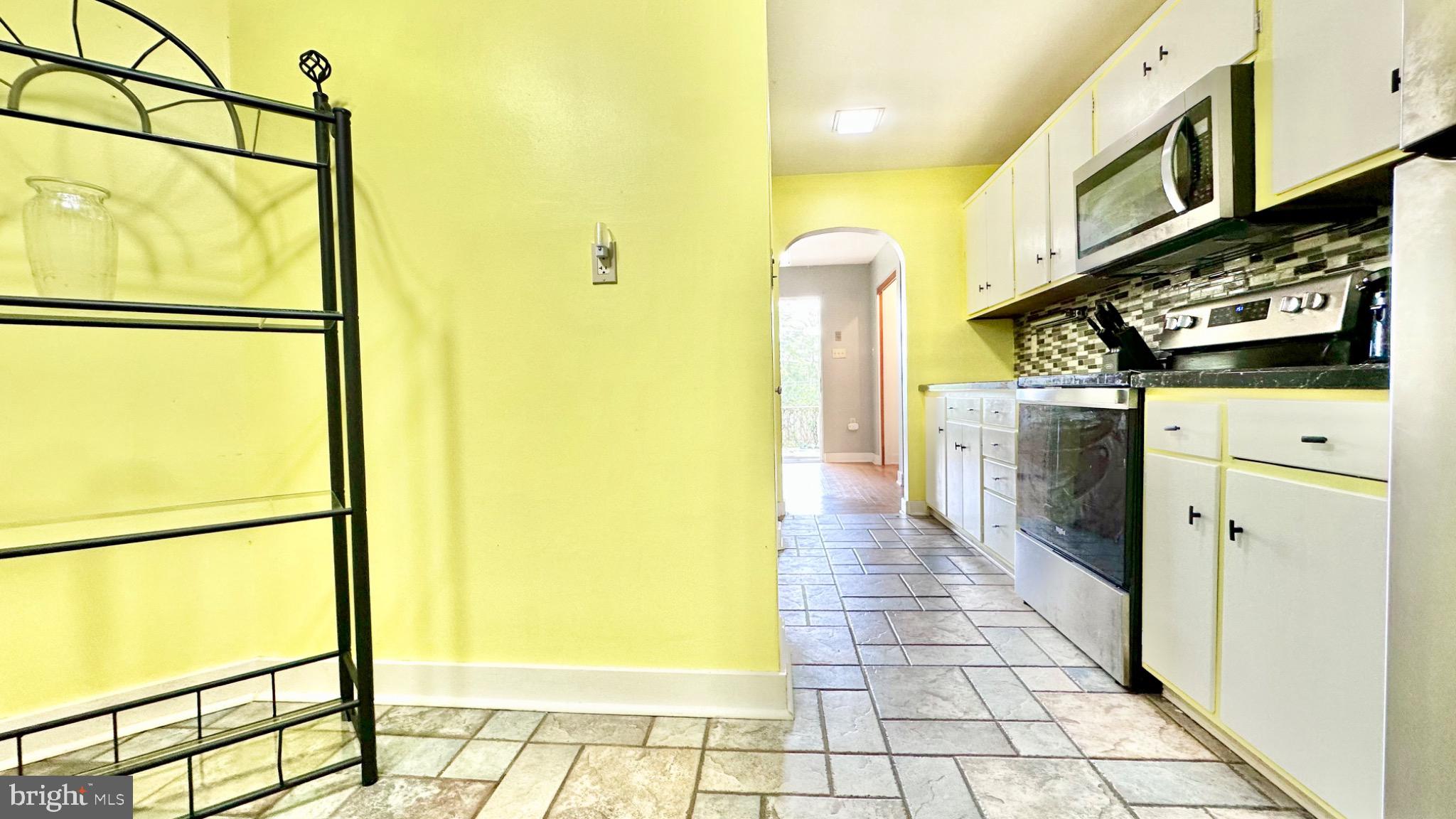 98 Maple Street Macungie, PA 18062 - Photo 8 of 56 Bright kitchen with cheerful yellow walls.