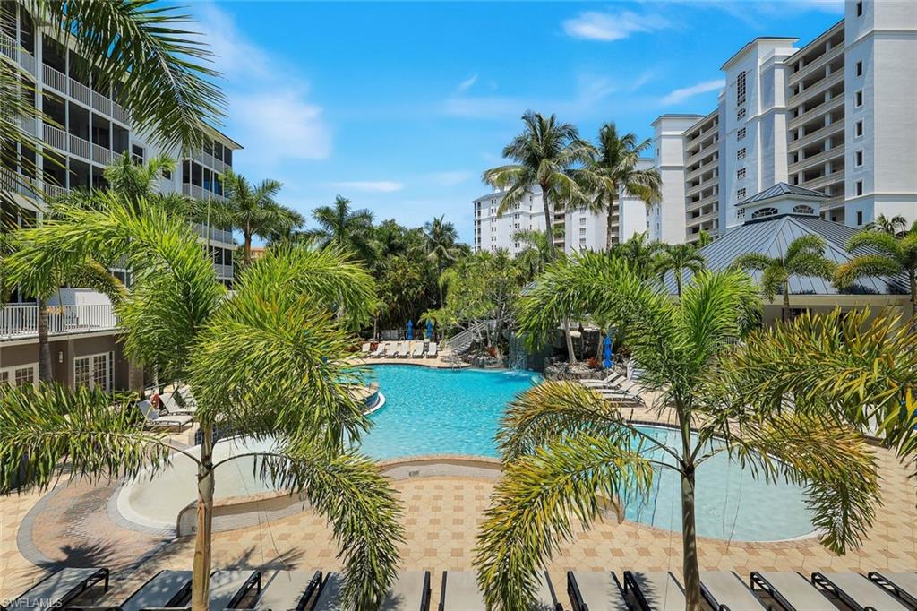 460 Launch Circle, Unit 202 Naples, FL 34108 - Photo 21 of 34 a view of a yard and palm trees