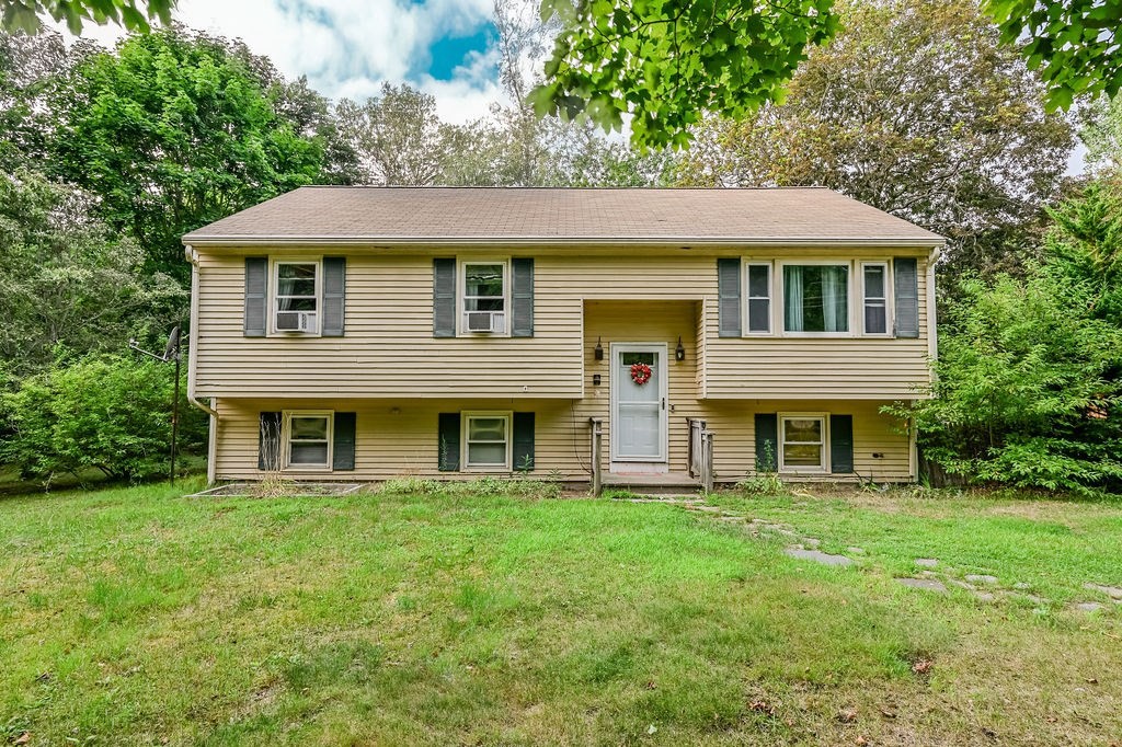 a front view of a house with a yard