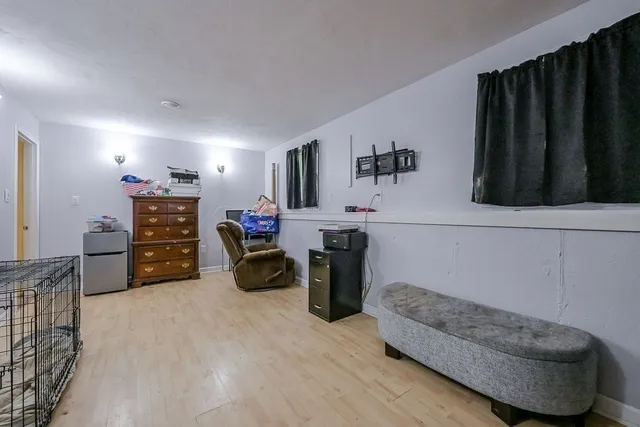 a bedroom with furniture and a dresser