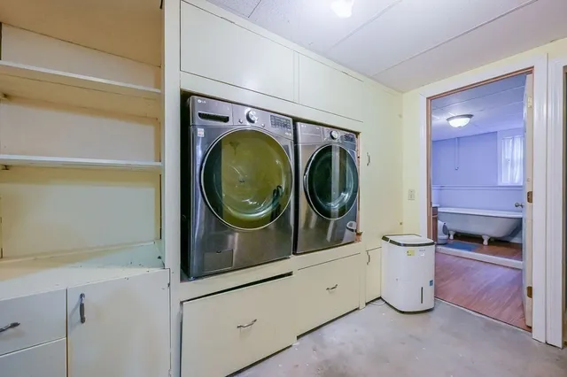 a bathroom with a toilet a sink and a mirror