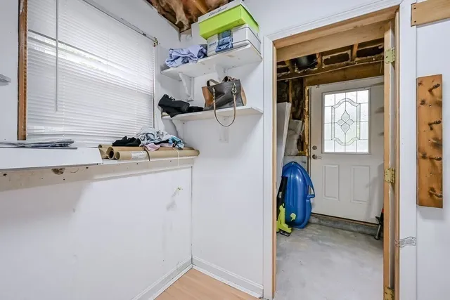 a utility room with closet dryer and washer