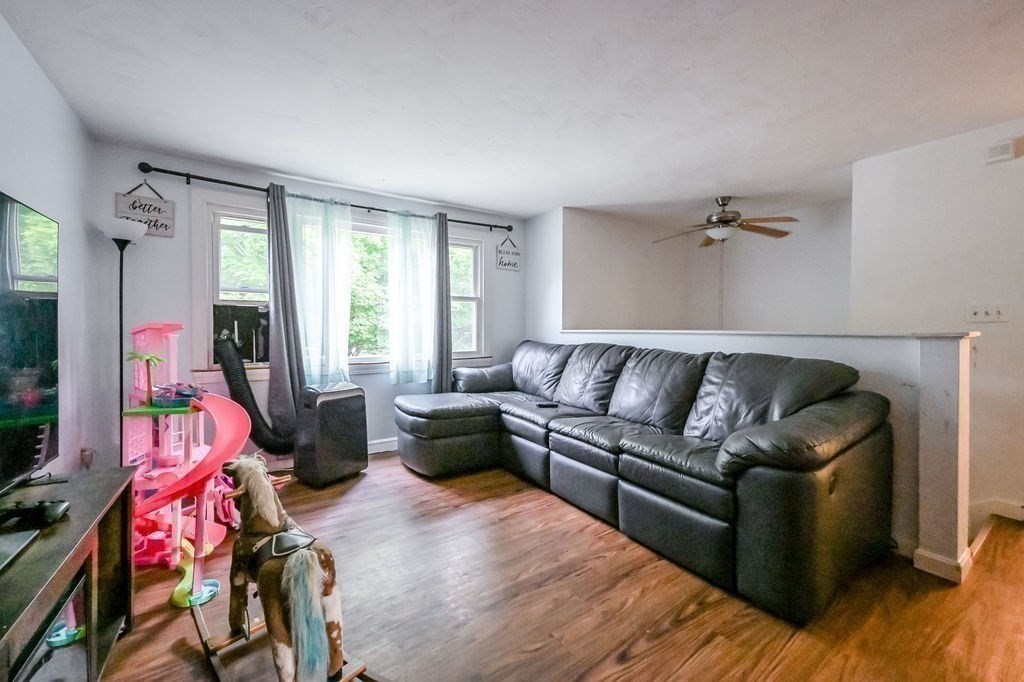 9 Lawrence Road Plymouth, MA 02360 - Photo 3 of 30 a living room with furniture and a flat screen tv
